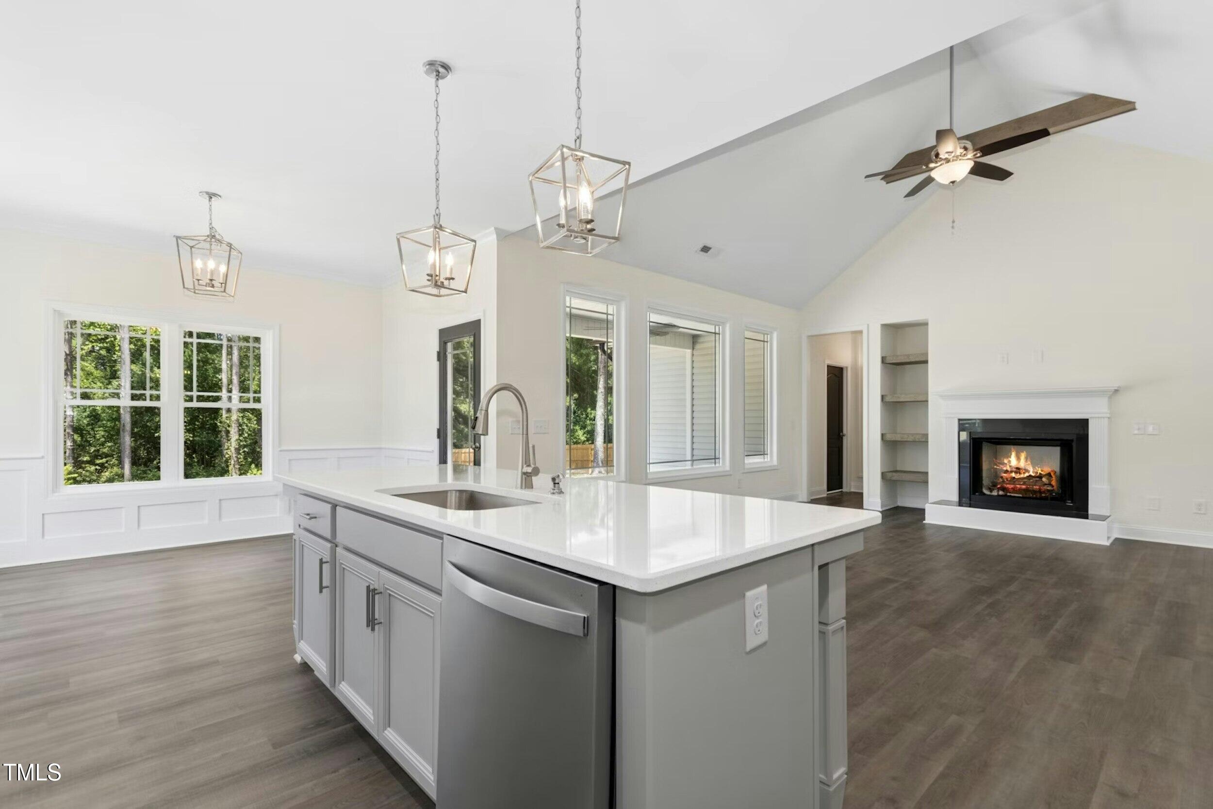 776 Shadetree Road Benson, NC 27504 - Photo 10 of 35 a open kitchen with a sink and dishwasher with wooden floor