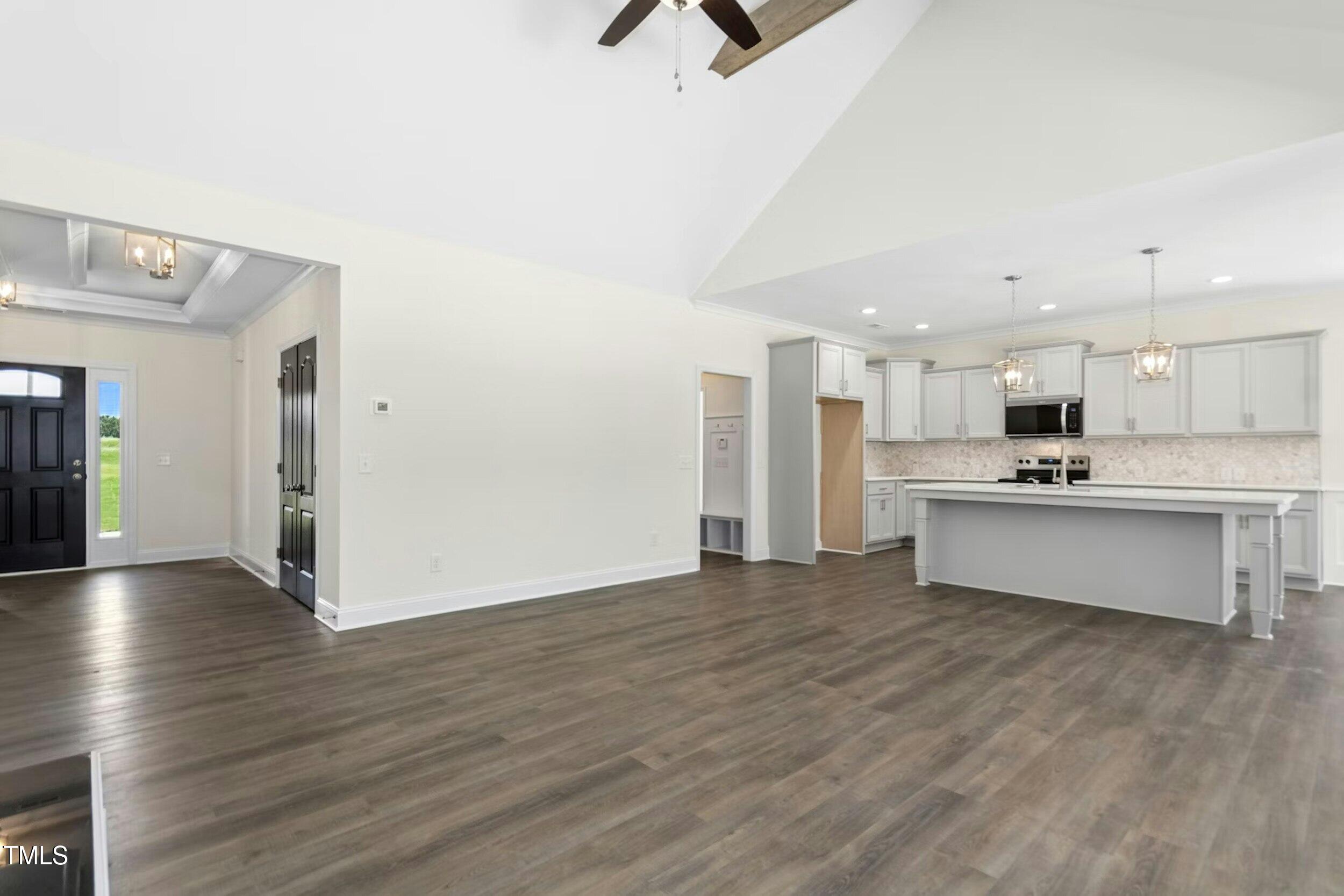 776 Shadetree Road Benson, NC 27504 - Photo 12 of 35 a view of kitchen with wooden floor and window