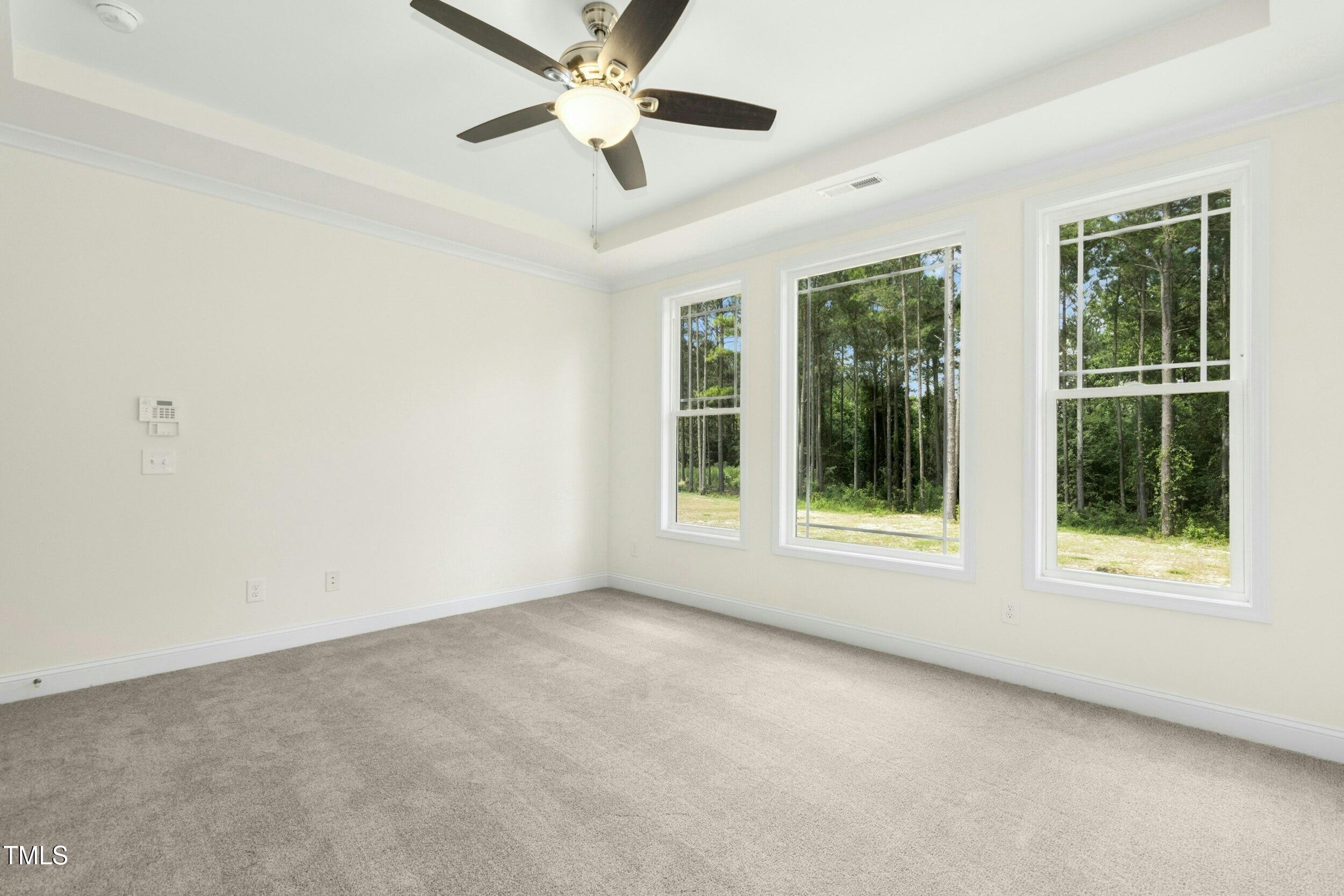 776 Shadetree Road Benson, NC 27504 - Photo 19 of 35 a view of an empty room with a window