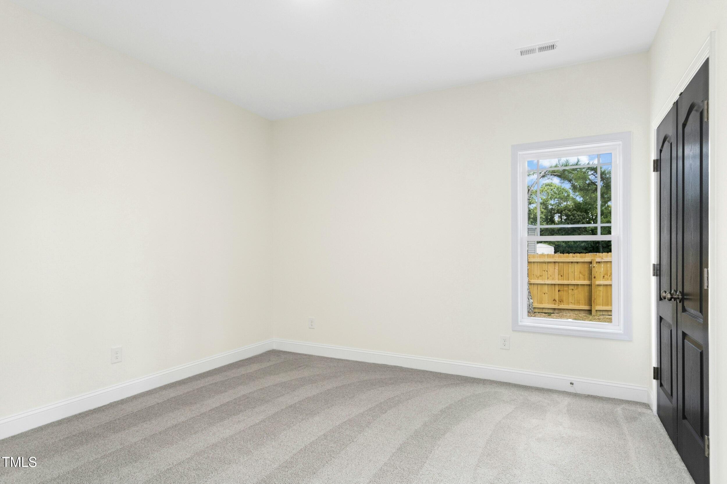 776 Shadetree Road Benson, NC 27504 - Photo 23 of 35 an empty room with a window