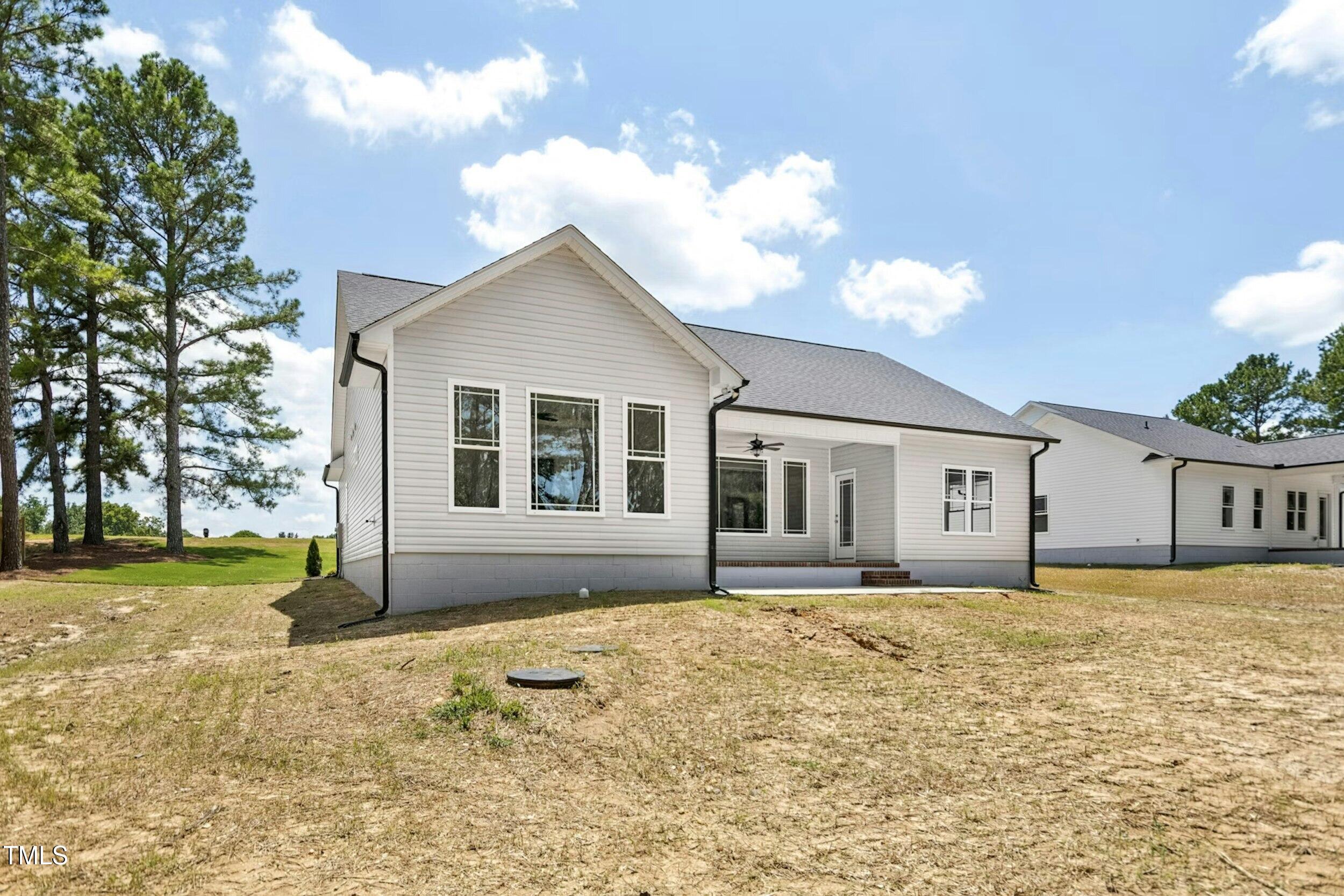 776 Shadetree Road Benson, NC 27504 - Photo 32 of 35 a house with trees in the background