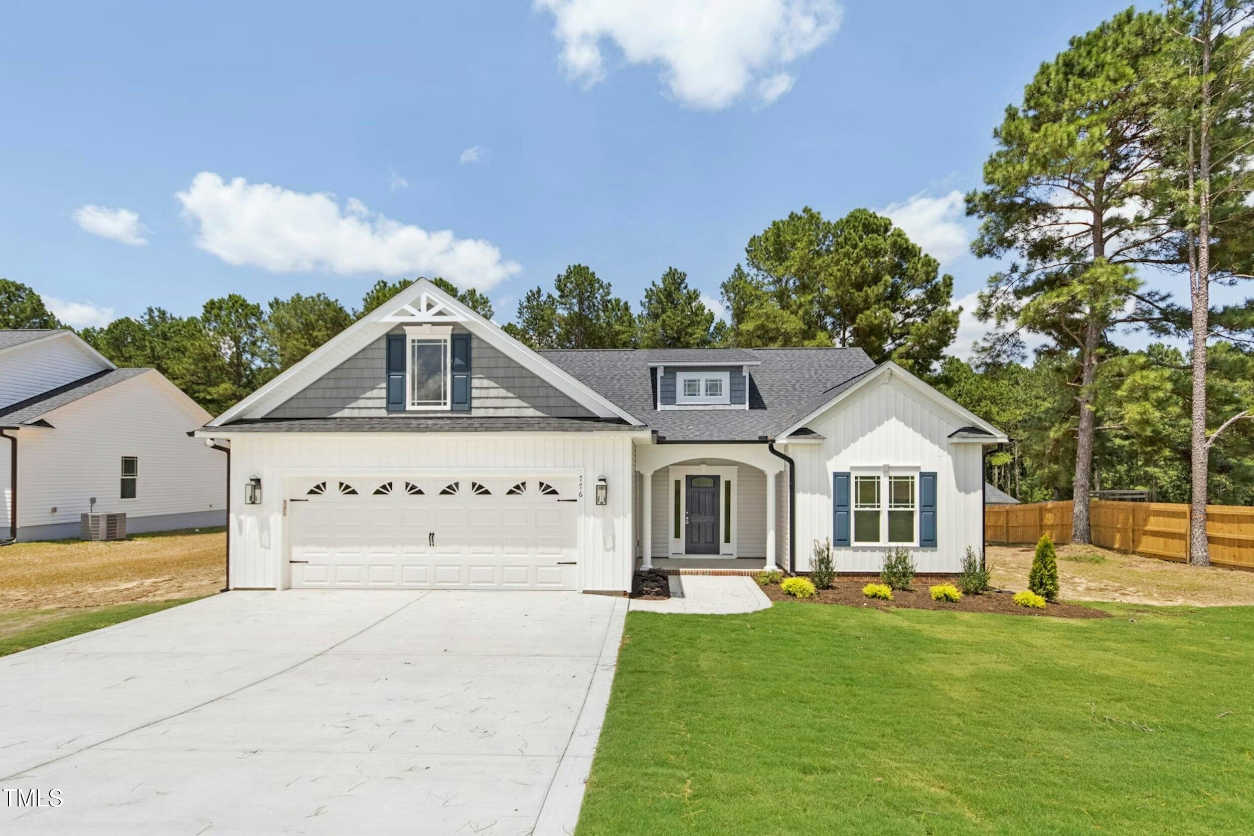 776 Shadetree Road Benson, NC 27504 - Photo 9 of 35 a front view of a house with a yard