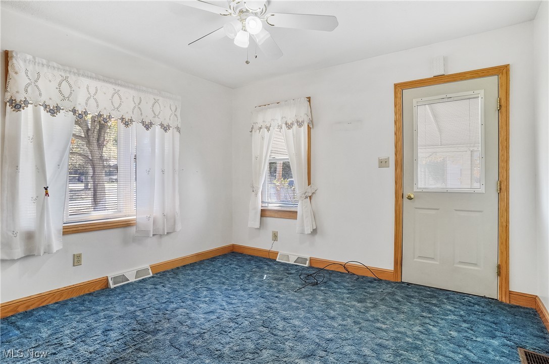 2809 McElwain Road Akron, OH 44312 - Photo 26 of 38 Carpeted dining room with ceiling fan, carpet, bay window on side