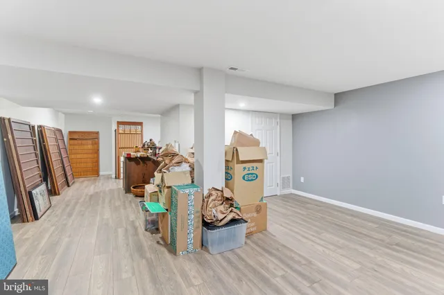 a view of a livingroom with furniture and a flat screen tv