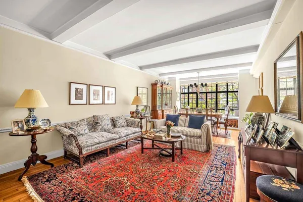 a living room with furniture and a lamp