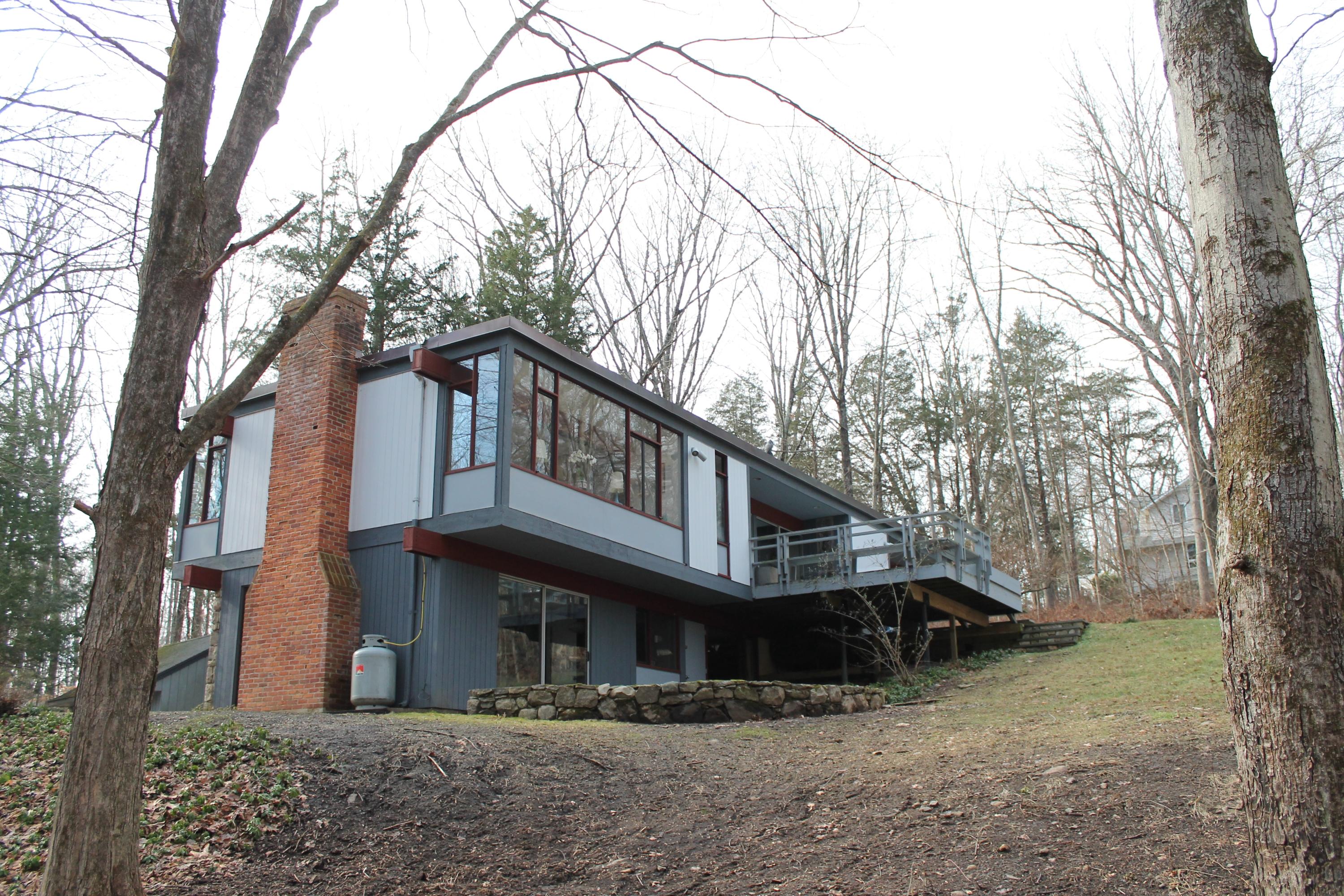 56 Farrell Road Weston, CT 06883 - Photo 5 of 33 a front view of a house with garden