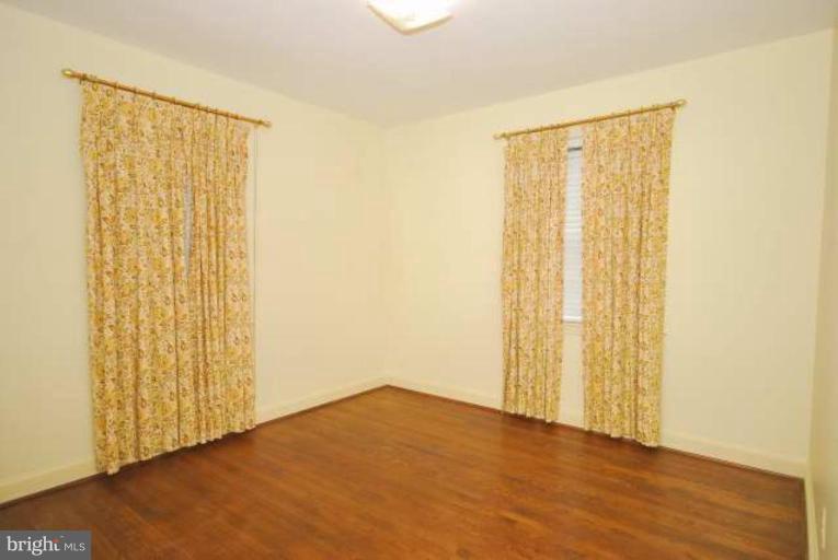 5308 Atlee Place Springfield, VA 22151 - Photo 12 of 14 a view of an empty room with wooden floor and a window