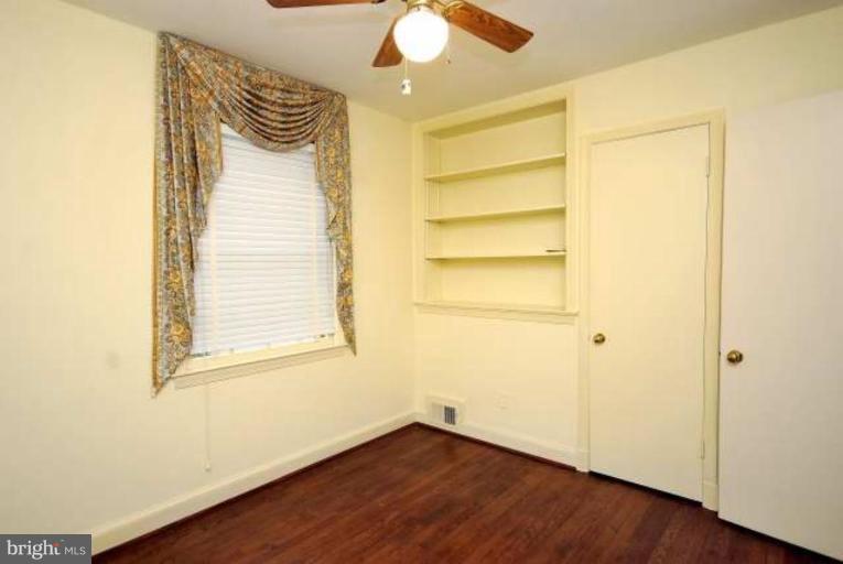 5308 Atlee Place Springfield, VA 22151 - Photo 9 of 14 a view of an empty room with wooden floor and a window