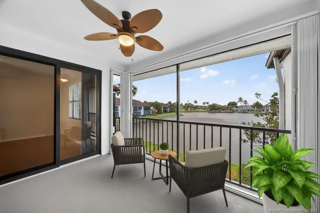 a dining room with furniture a rug and wooden floor