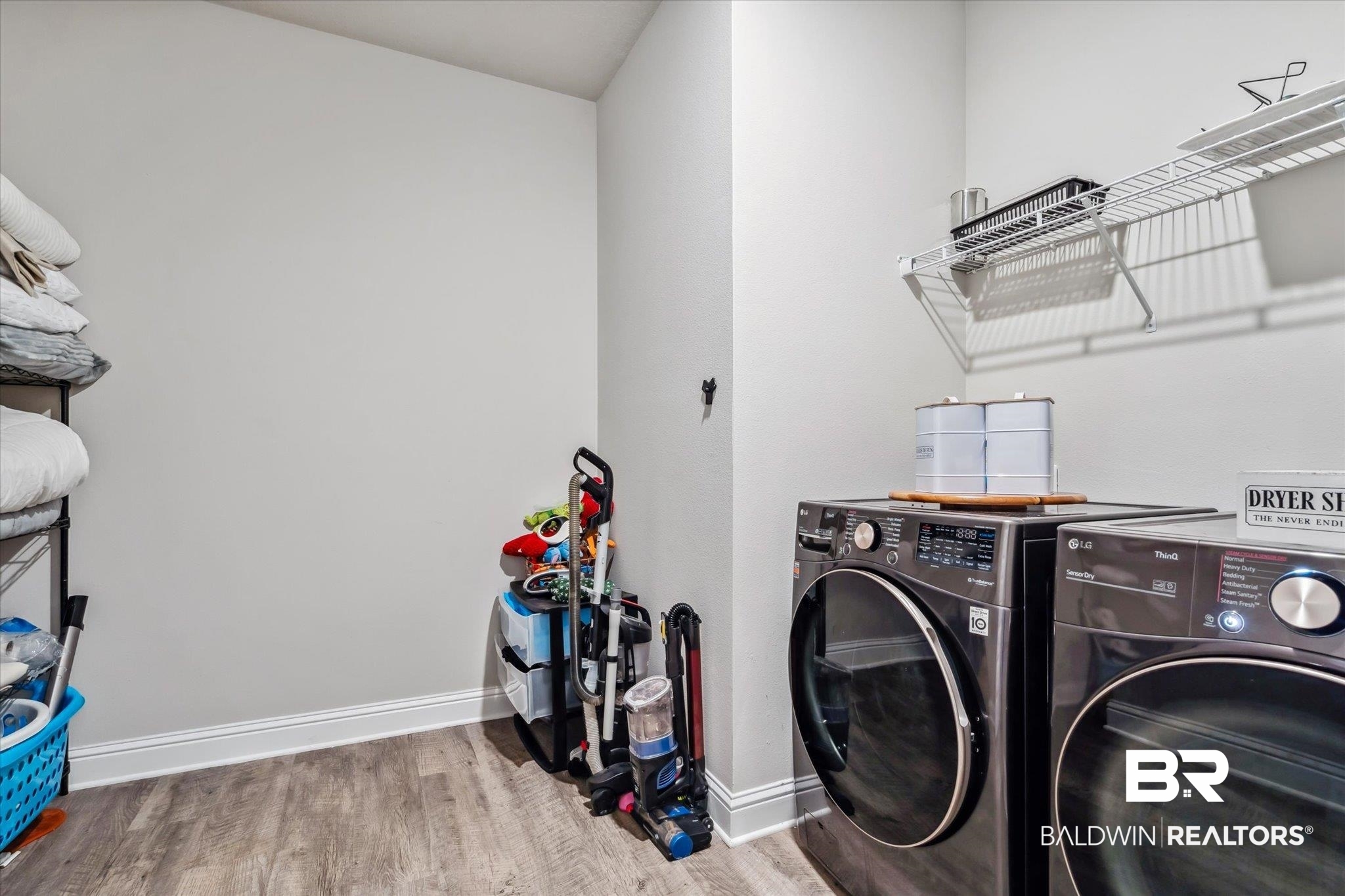 10501 Loamy Avenue Mobile, AL 36695 - Photo 25 of 30 Laundry room with washing machine and dryer and hardwood / wood-style floors