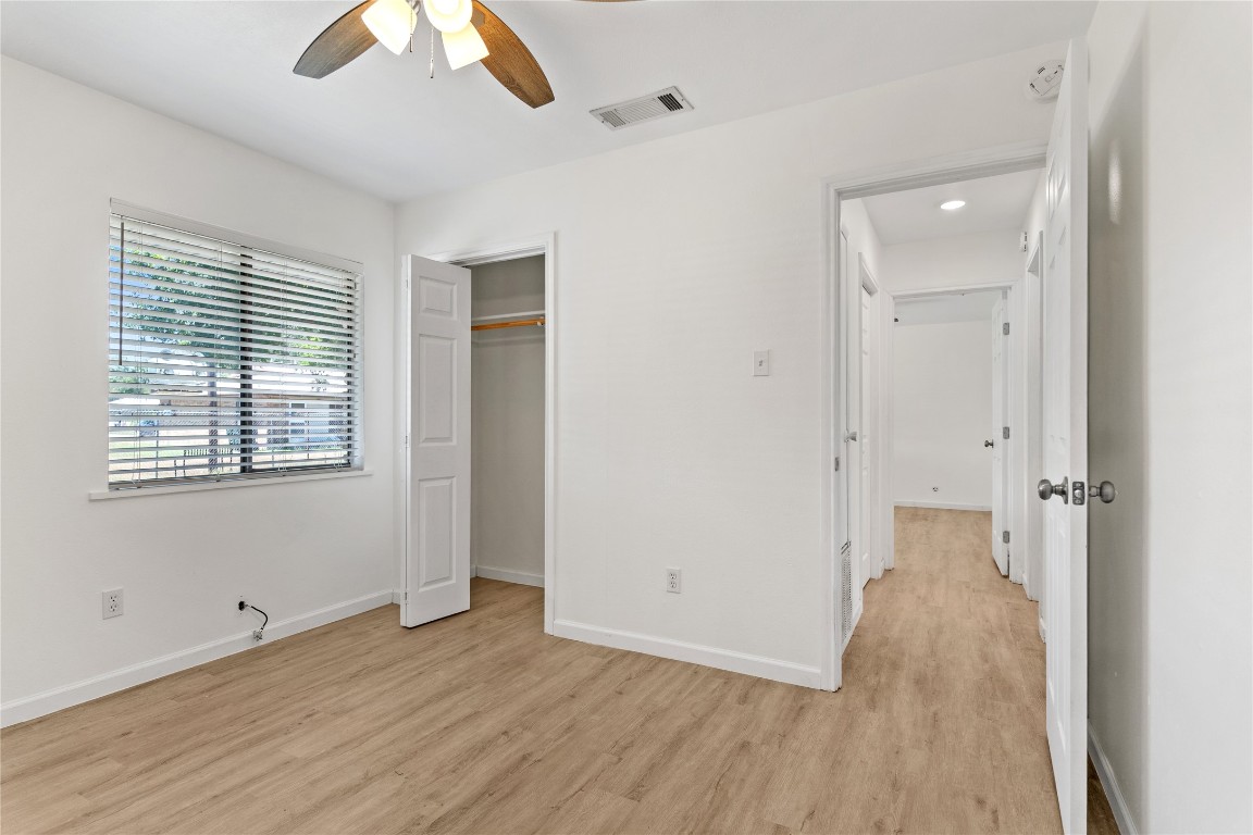 607 Magnolia Street Bastrop, TX 78602 - Photo 18 of 25 wooden floor in an empty room with a window
