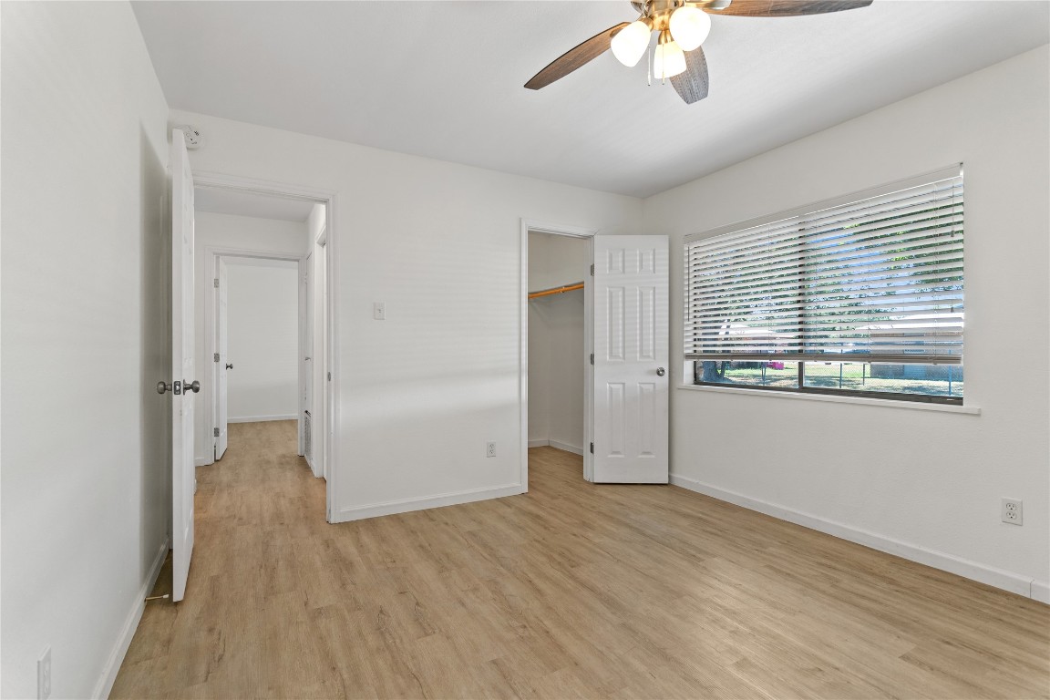 607 Magnolia Street Bastrop, TX 78602 - Photo 20 of 25 a view of empty room with wooden floor and fan