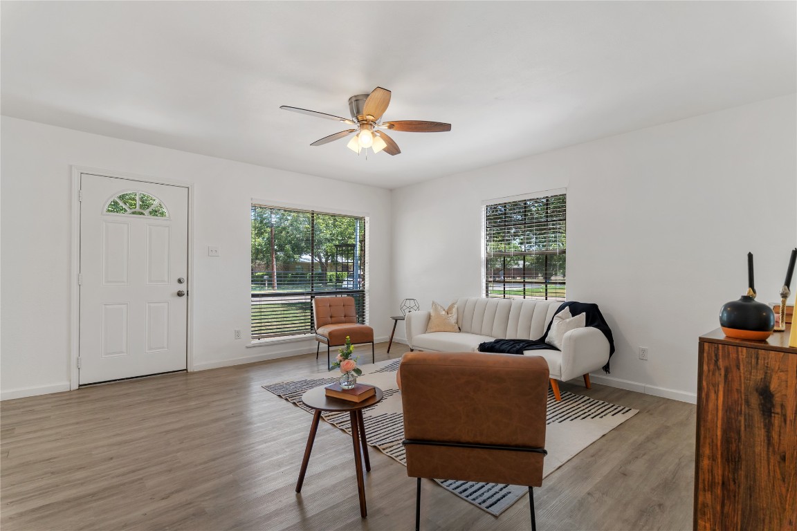 607 Magnolia Street Bastrop, TX 78602 - Photo 2 of 25 a living room with furniture a window and wooden floor