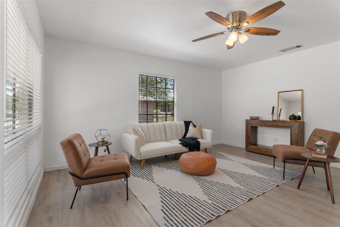 607 Magnolia Street Bastrop, TX 78602 - Photo 8 of 25 a living room with furniture a rug and a window