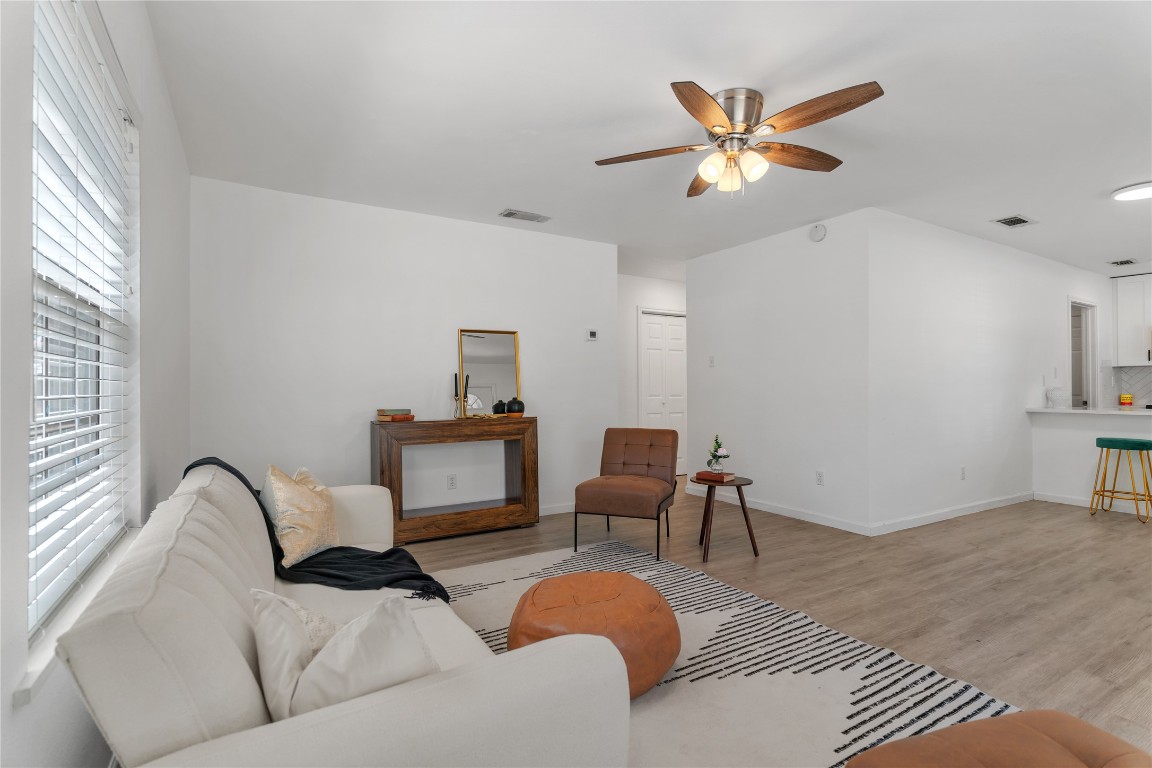 607 Magnolia Street Bastrop, TX 78602 - Photo 10 of 25 a living room with furniture and a ceiling fan