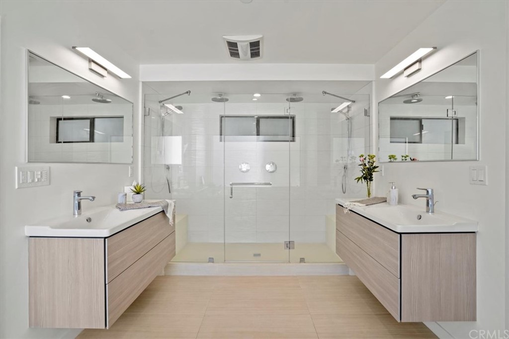 361 Aster Street Laguna Beach, CA 92651 - Photo 12 of 25 a spacious bathroom with a double vanity sink mirror and