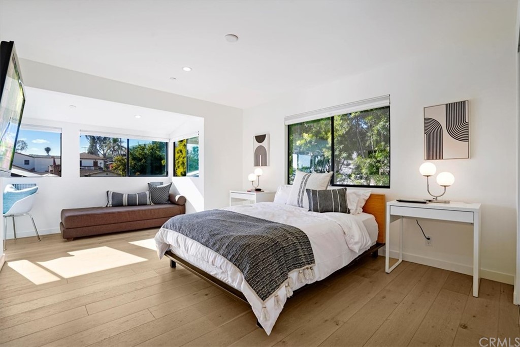 361 Aster Street Laguna Beach, CA 92651 - Photo 16 of 25 a bedroom with a large bed and a large window