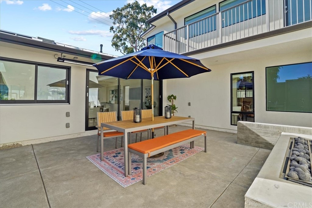 361 Aster Street Laguna Beach, CA 92651 - Photo 17 of 25 a backyard of a house with table and chairs