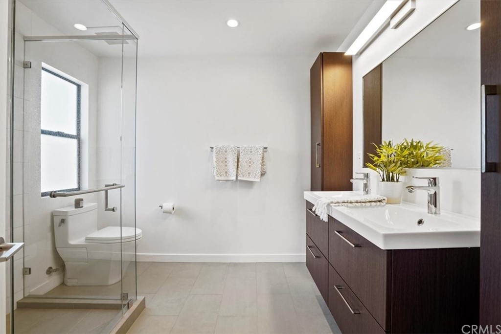 361 Aster Street Laguna Beach, CA 92651 - Photo 25 of 25 a bathroom with a double vanity sink mirror and toilet