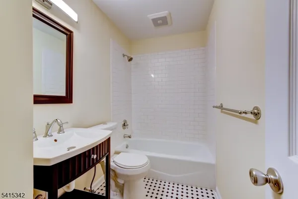 a bathroom with a sink toilet a shower and bathtub