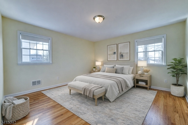 3 Michael Lane Somerville, NJ 08876 - Photo 19 of 31 a spacious bedroom with a bed and wooden floor