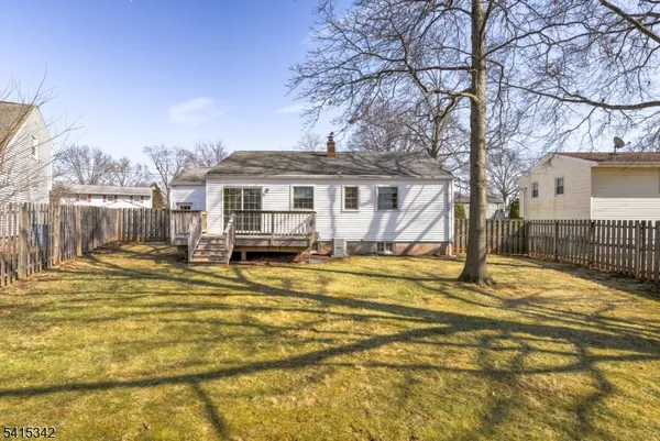 a view of pool with a yard