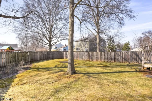 a view of street with wooden fence