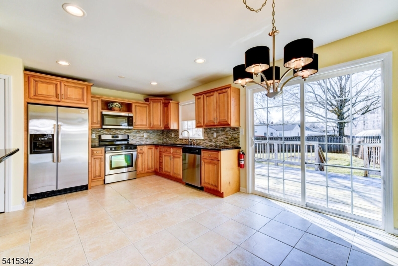 3 Michael Lane Somerville, NJ 08876 - Photo 10 of 31 a kitchen with stainless steel appliances granite countertop a refrigerator and a sink