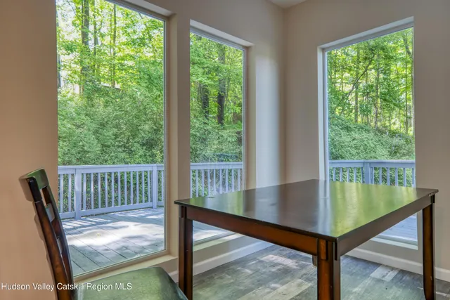 a view of a living room and floor to ceiling window