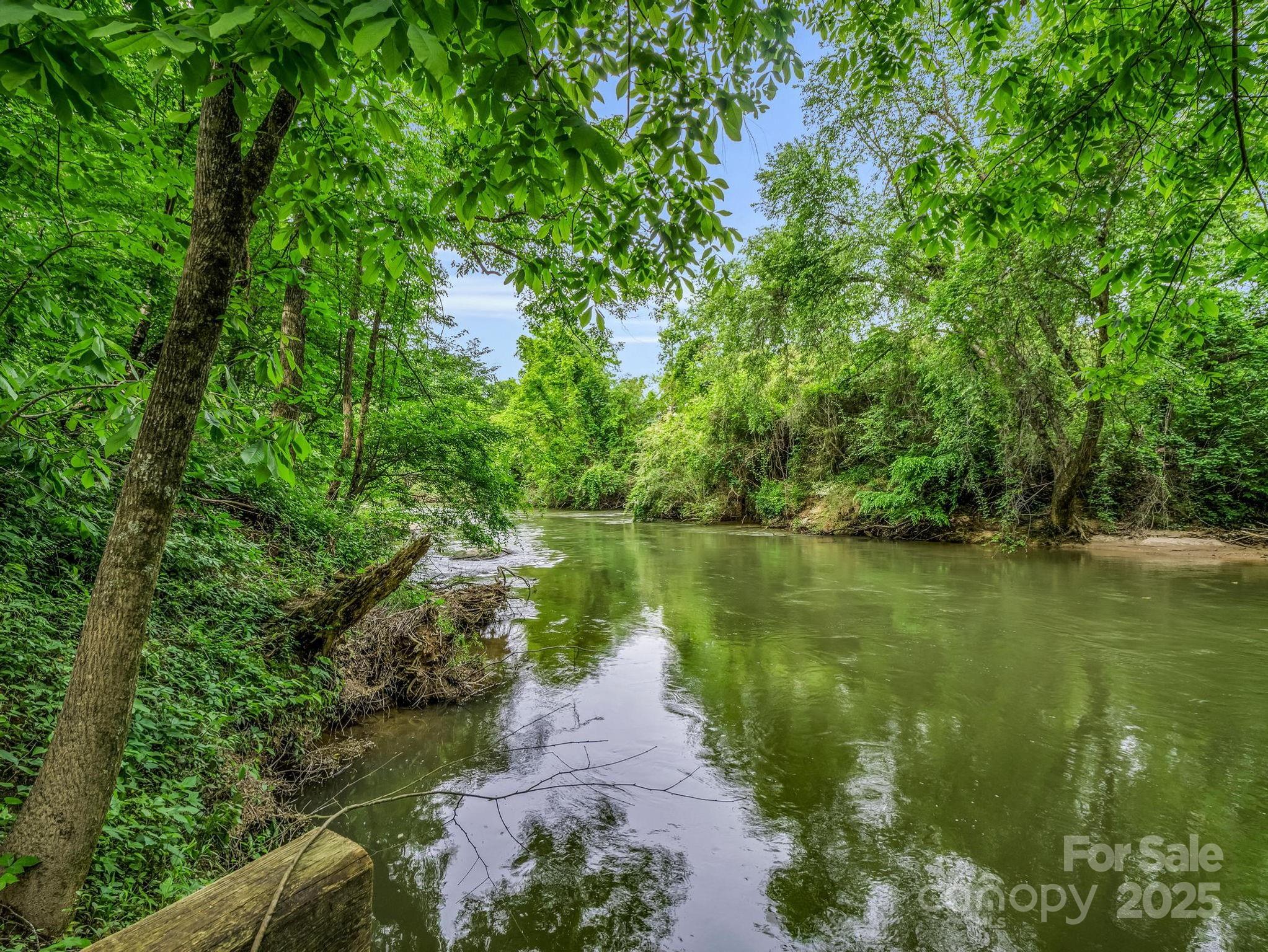 999 River Crest Parkway, Unit 28 Rutherfordton, NC 28139 - Photo 1 of 23 a view of a lake view with a garden