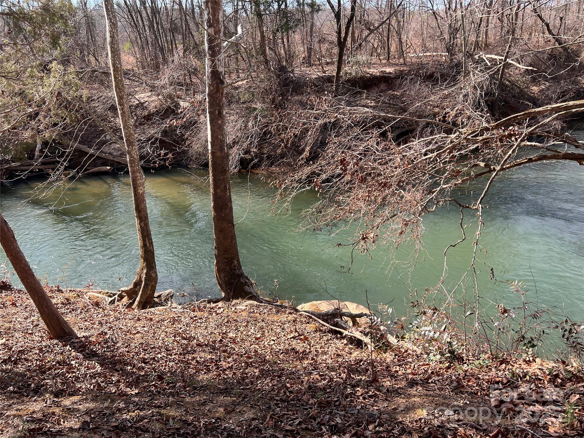 999 River Crest Parkway, Unit 28 Rutherfordton, NC 28139 - Photo 3 of 23 a view of a lake from a yard