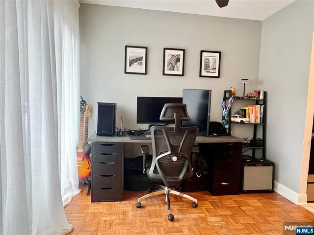 a view of a workspace with furniture