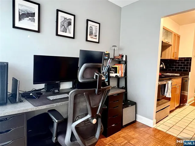 a view of workspace with wooden floor windows