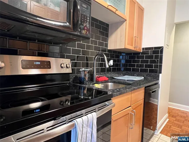 a close view of a stove and a microwave oven