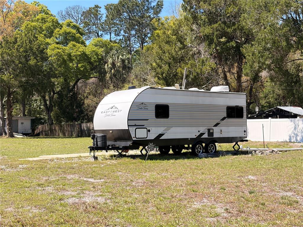 276 Marjorie Street Inglis, FL 34449 - Photo 2 of 5 a view of a house with a yard