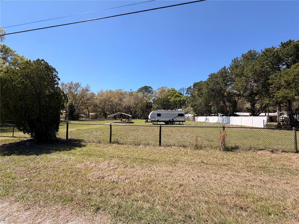 276 Marjorie Street Inglis, FL 34449 - Photo 5 of 5 a view of a yard