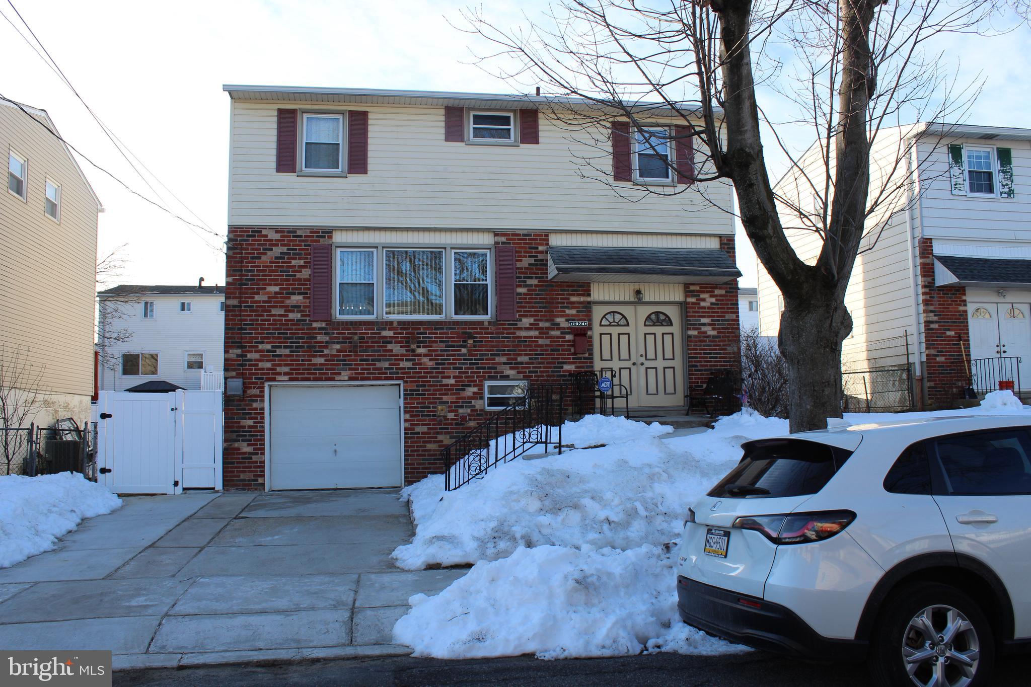 1974 King Arthur Road Philadelphia, PA 19116 - Photo 2 of 8 a front view of a house with parking space