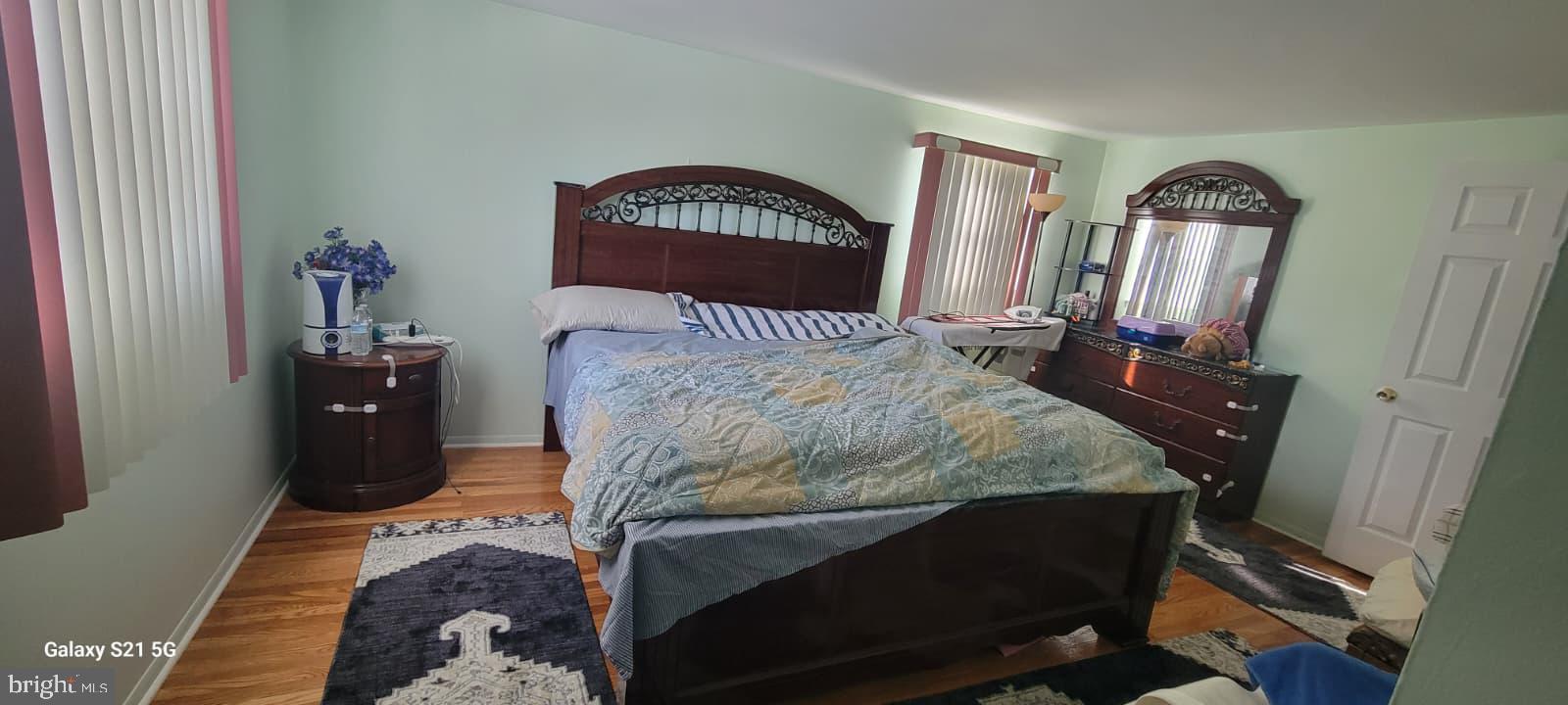 1974 King Arthur Road Philadelphia, PA 19116 - Photo 4 of 8 a bedroom with a bed a dresser and mirror