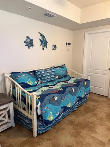 a room with furniture and a chandelier