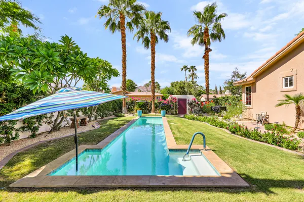 a view of a swimming pool with a garden