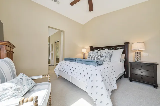 a bedroom with bed and window