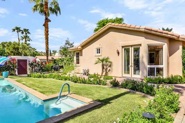 a view of a house with swimming pool