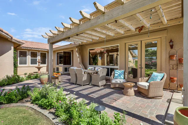 a living room with fireplace furniture and a flat screen tv