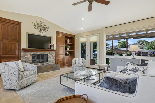 an aerial view of a house with a yard and garden