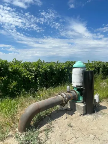 a view of a porch with furniture and a yard