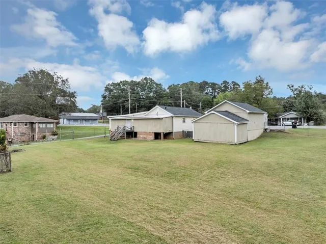 a view of a swimming pool with a patio
