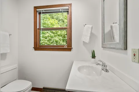 a bathroom with a sink toilet and tub