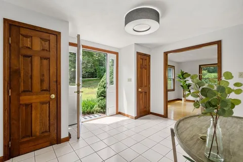 a view of entryway with livingroom and furniture