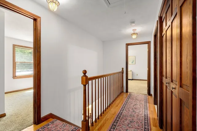 a view of hallway with wooden floor