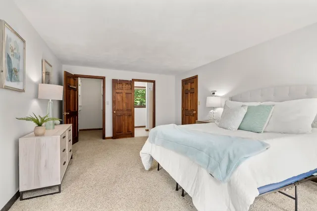 a bedroom with a bed and window